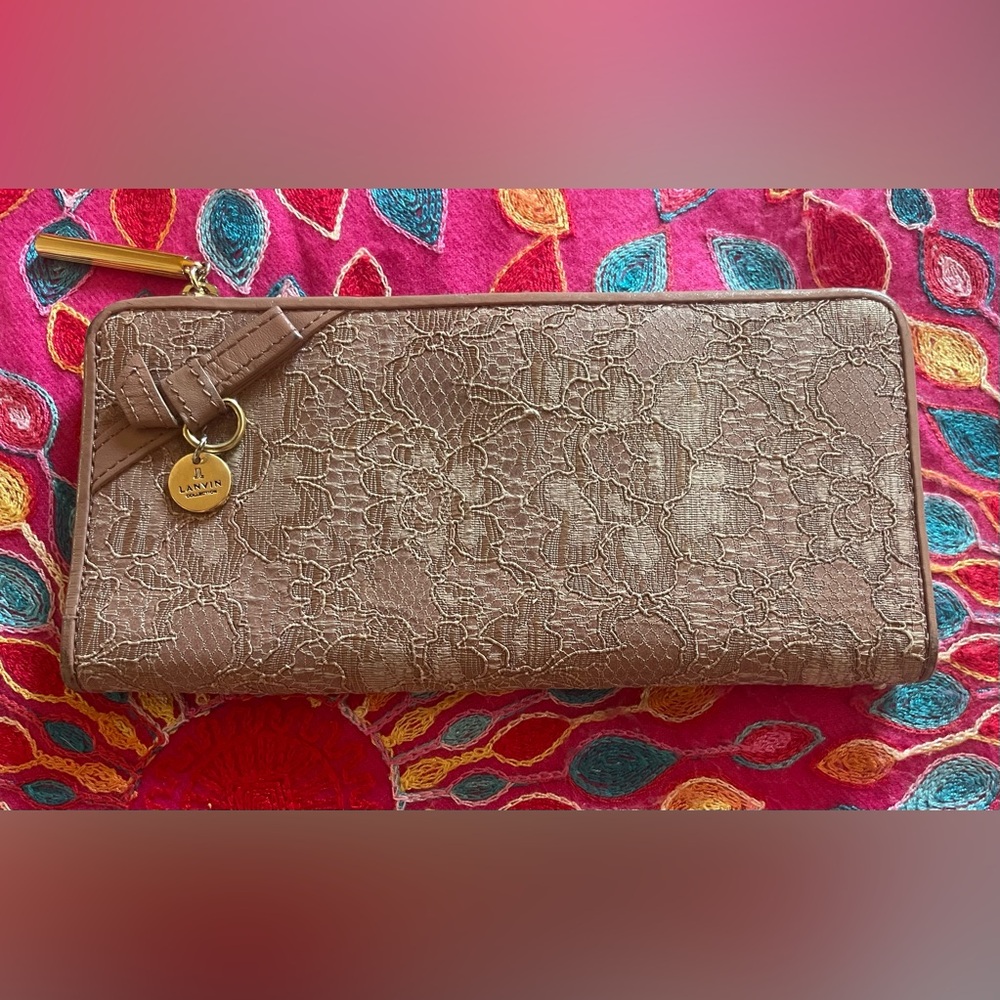 Luscious Lanvin tan lace wallet. Approximately 7 x 4“. New without tags.